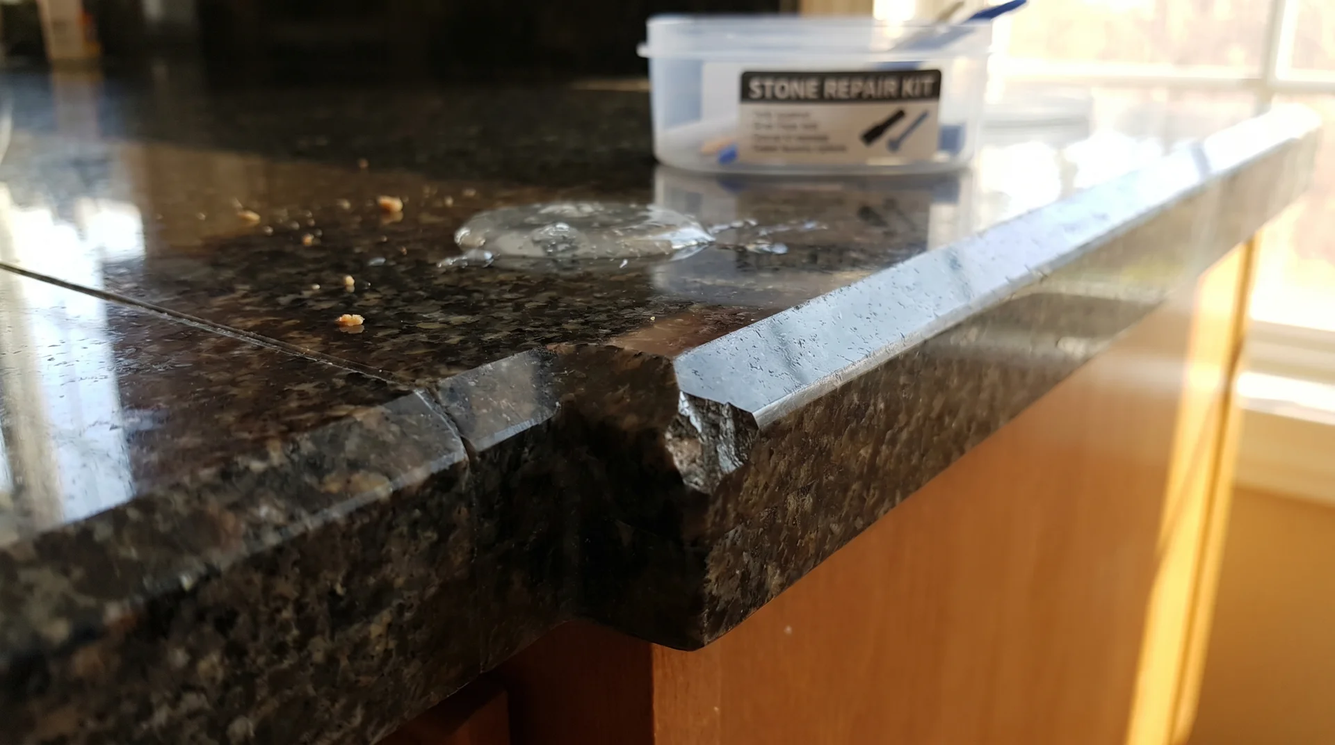 Small chip on the edge of a granite countertop