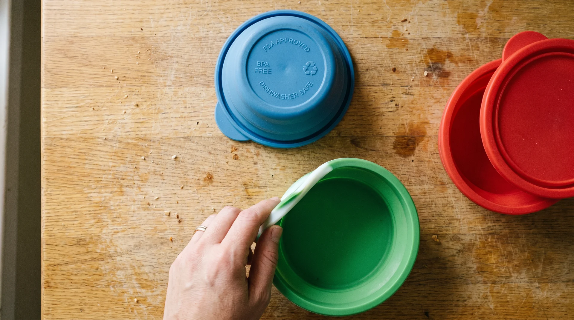 Three-step silicone microwave safety check — label inspection, pinch test, and vented lid