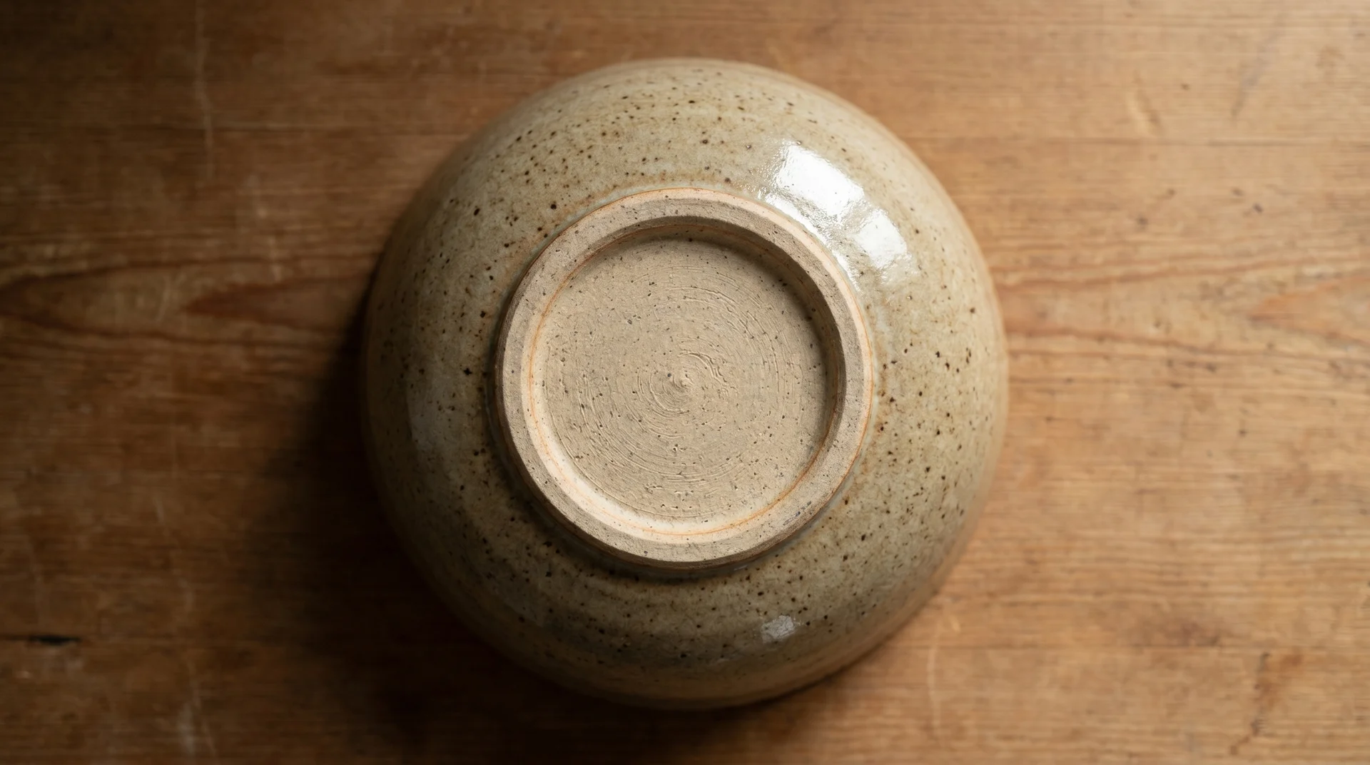 Stoneware bowl base showing clean unglazed foot ring and intact glaze — microwave safe
